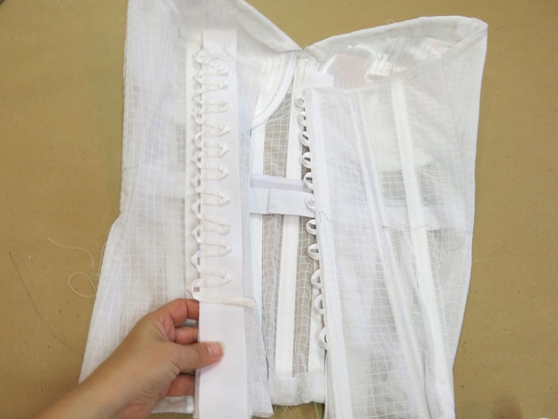 How to Put a Corset Back in a Wedding Dress, eHow