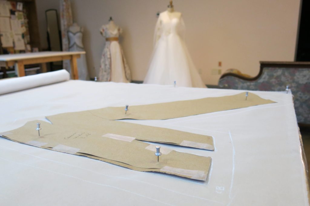 Laying out the pattern to cut Cameron's mockup by Brooks Ann Camper Bridal Couture