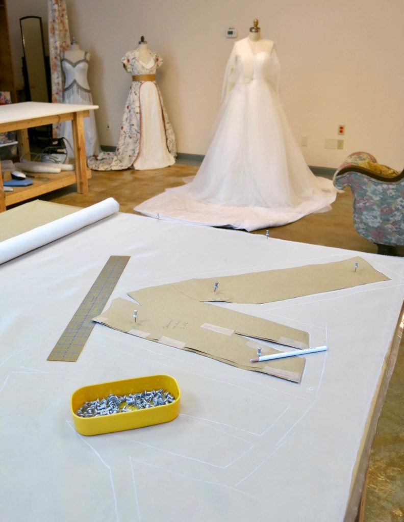 Laying out the pattern to cut Cameron's mockup by Brooks Ann Camper Bridal Couture