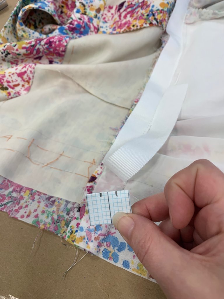 Brooks Ann holds a buttonhole template