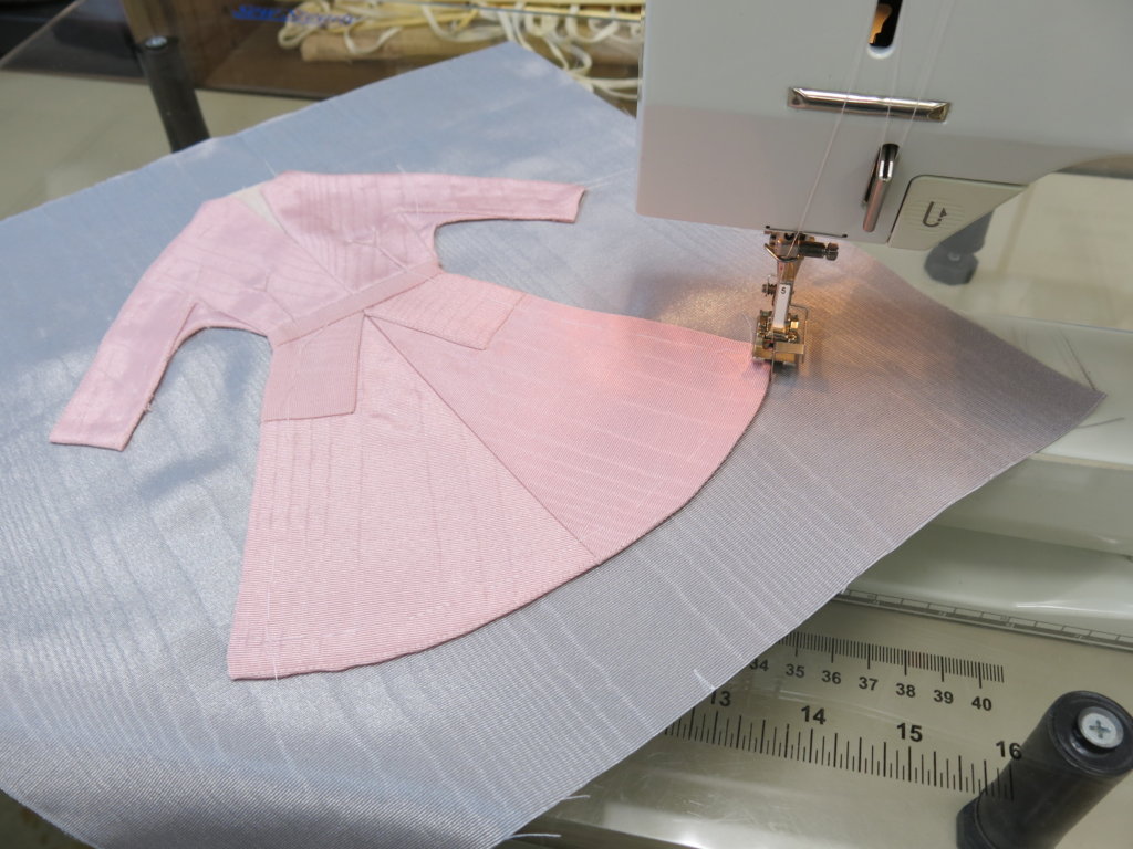 Stitching the dress to the square